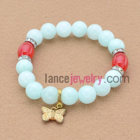Fshion stone basis bead bracelet with alloy butterfly pendant.