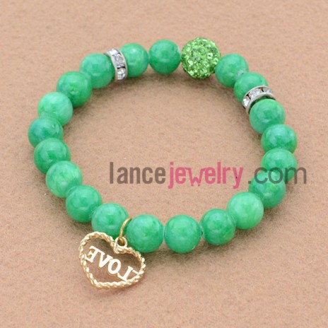 Nice rhinestone decorated bead bracelet with love pendant.