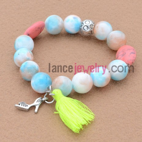 Unique design bead bracelet with lady shoes pendant and tassels.