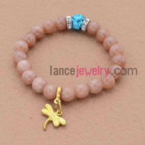 Fashion rhinestone decorated bead bracelet with dragonfly pendant.