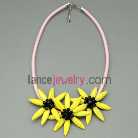 Pink leather necklace with three yellow turquoise flowers 
