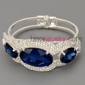 Charming bracelet with brass claw chain decorated many shiny rhinestone and deep blue crystal
