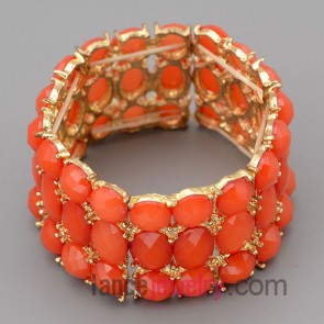 Shiny bracelet with gold zinc alloy decorate orange resin