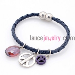 Peace pendant and crystal decorated charm bracelet