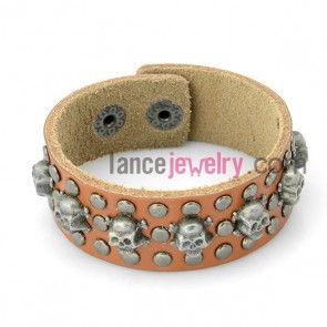 Special bracelet with orange leather decorated many skeleton and alloy snap fastener 