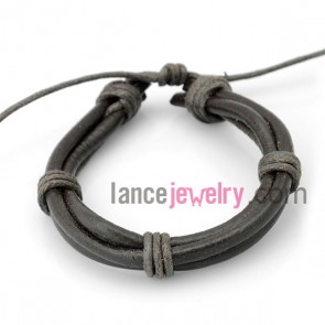 Cool bracelet decorated with black leather wrapped around deep gray rubber

