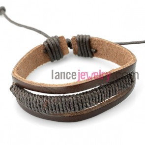 Fashion bracelet with brown  leather decorated deep gray rubber
