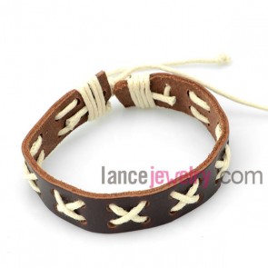 Cute bracelet decorated with brown leather wrapped around white rubber
