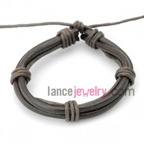 Cool bracelet decorated with gray  leather wrapped around same color rubber
