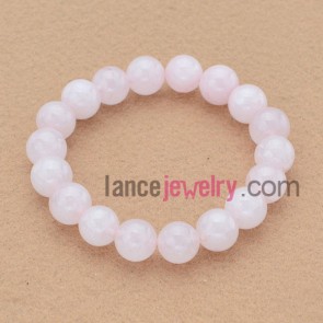 Simple pink color stone basis bead bracelet.