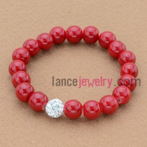 Nobby red color stone bead bracelet with rhinestone decoration.