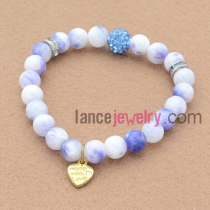 Fashion rhinestone process bead bracelet with sweet pendant.