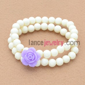 Sweet bead bracelet with flower pendant.