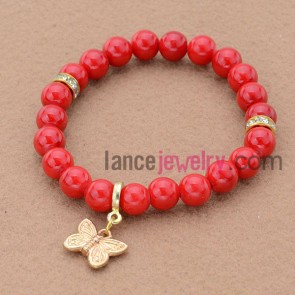 Gorgeous red color and rhinestone bead bracelet with butterfly pendant.