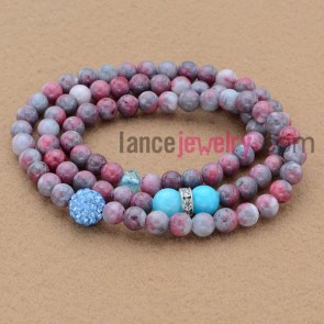 Multicolor bead bracelet with rhinestone decoration.
