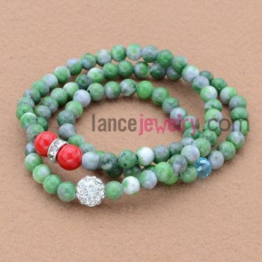 Trendy rhinestone and acrylic decorated bead bracelet.