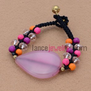 Clear stone and acrylic material weaving bracelet.