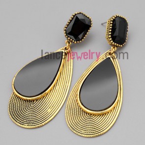 Cool earrings with gold zinc alloy decorated black resin