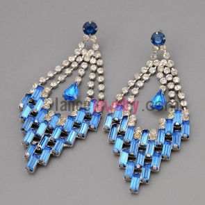 Elegant earrings with claw chain decorate many shiny rhinestone and blue crystal