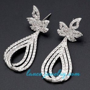 Distinctive brass alloy earrings decorated with cubic zirconia