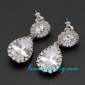 Original brass alloy earrings decorated with cubic zirconia