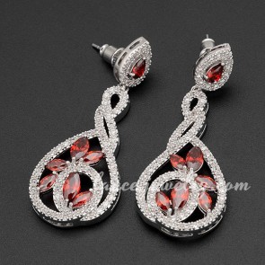 Unusual red cubic zirconia decorated the brass alloy earrings