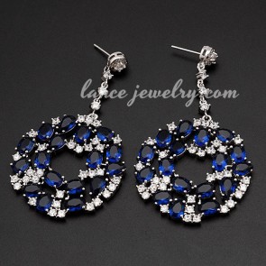 Distinctive brass alloy earrings with blue cubic zirconia decoration