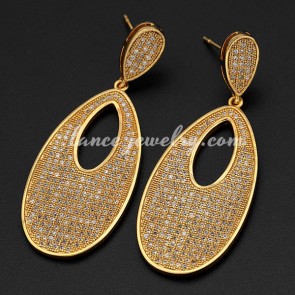 Unusual brass alloy earrings decorated with real gold plating