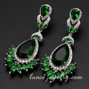 Glittering green pendants of cubic zirconia decorated the brass alloy earrings