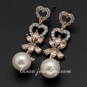 Delicate heart-shaped earrings with bead pendants decoration