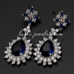 Distinctive drop earrings decorated with blue cubic zirconia
