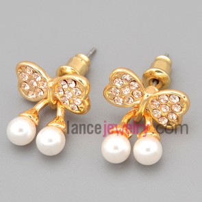 Charming stud earrings with gold zinc alloy with bowknot model decorated shiny rhinestone and abs beads 
