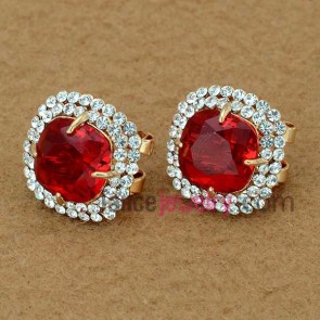 Delicate stud earrings with rhinestone and red crystal decoration