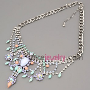 Romantic necklace with silver metal chain and brass parts and rhinestone and multicolor resin pendant