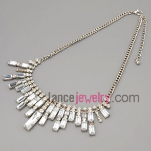 Shiny necklace with silver metal chain and brass parts and rhinestone and transparent crystal 