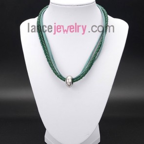 Striking necklace decorated with green measles and wax rope