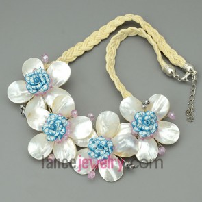 Yellow wax cord necklace, with four white shell flowers and polymer clay flowers