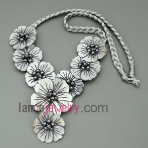 Triangle shape necklace, made of eight grey shell flowers