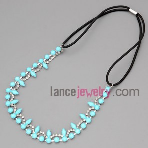 Sweet necklace with black cord and claw chain and rhinestone 
and light blue resin
