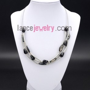 Cool necklace decorated with shining black crystal and brass