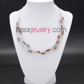 Glittering necklace decorated with  shining red crystal and brass 
