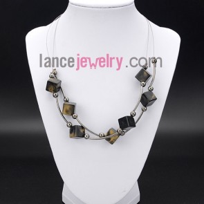 Cool necklace decorated with cube
and brass