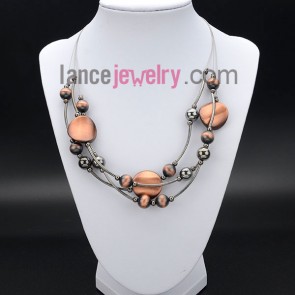 Delicate necklace decorated with ccb in deep orange and brass
