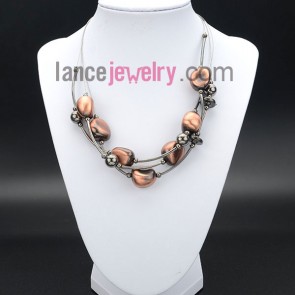 Romantic necklace decorated with ccb in deep orange and silver brass
