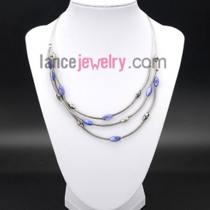 Glittering necklace with purple shell beads and thin brass

