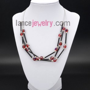 Striking necklace with many red crystal beads and glass tube 
 