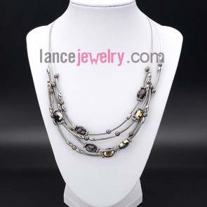 Elegant necklace with many shiny crystal beads and brass
 