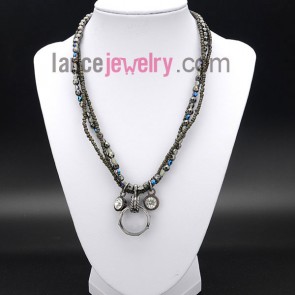 Romantic necklace with shiny crystal and ring pendants 
