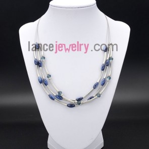 Fashion necklace with shiny shell beads and brass