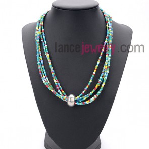 Colorful necklace with many small size
measles and alloy ring